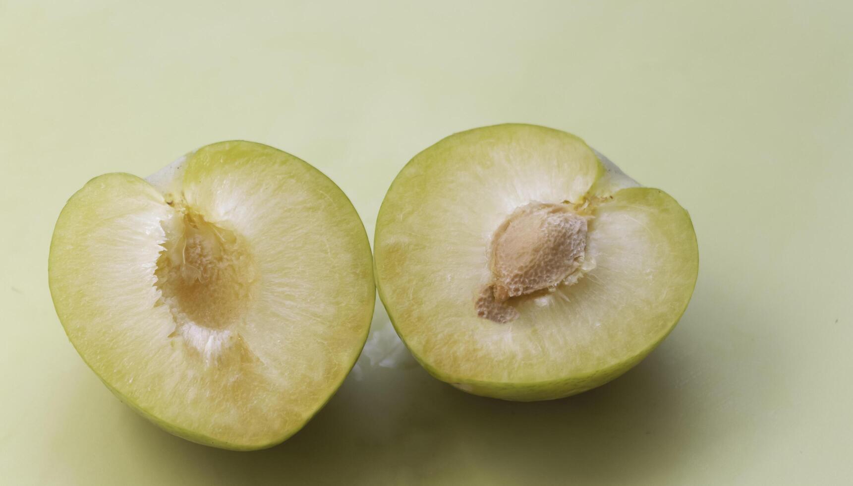 Cutted of Lemon Plum with yellow pulp, photo