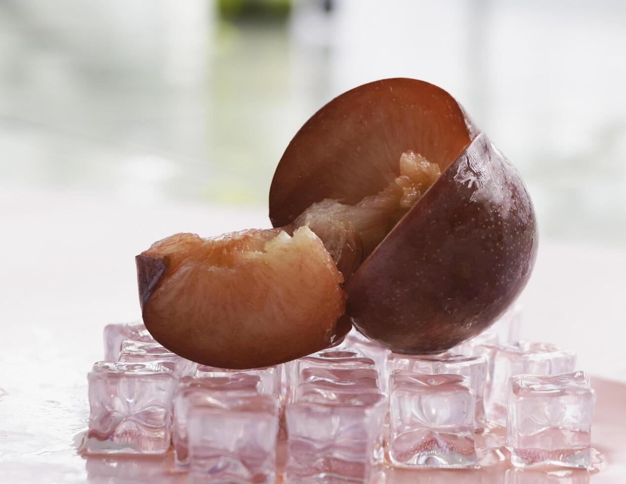 Cutted of Plumcot fruit with red pulp photo