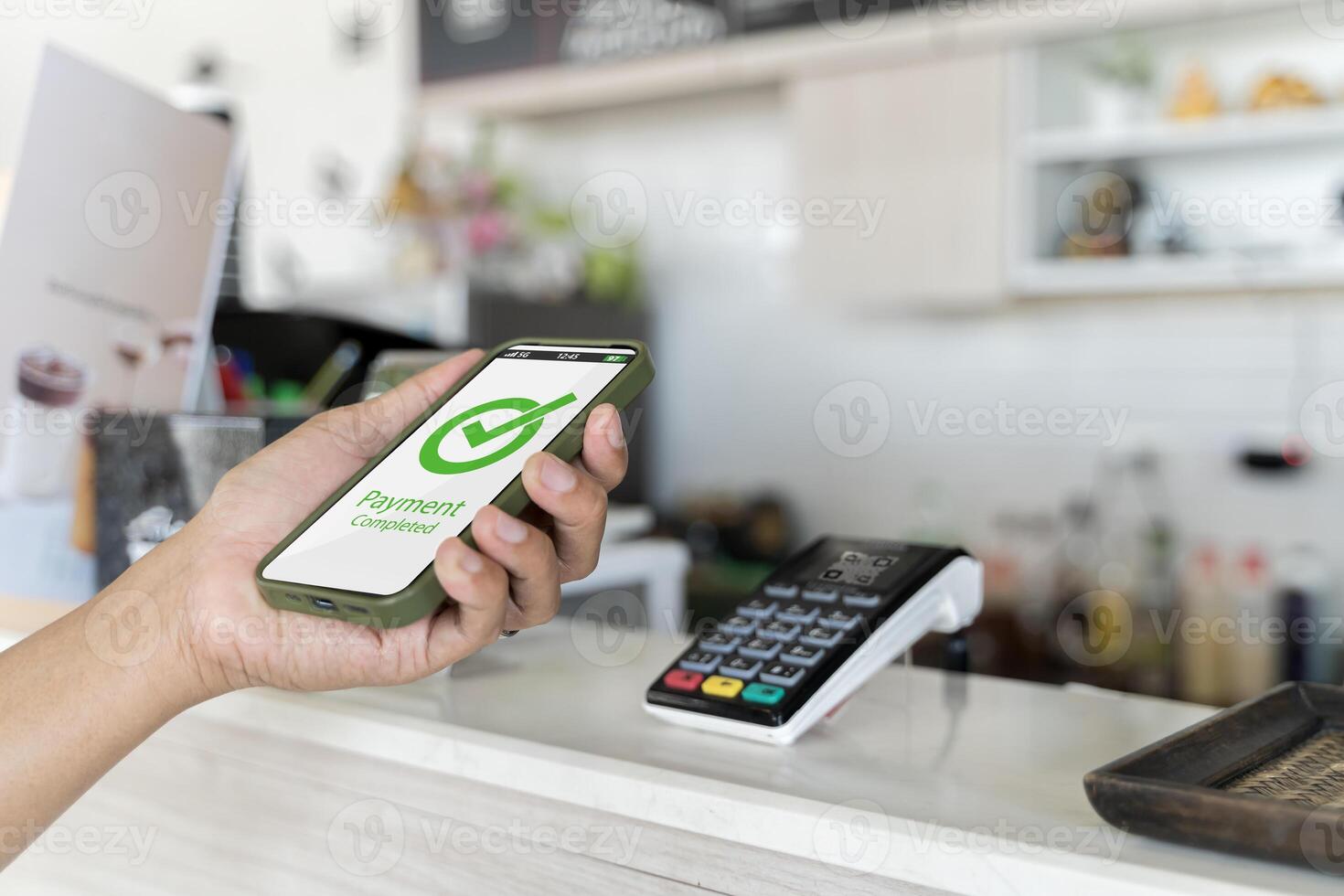 Customer using phone for payment at cafe restaurant, cashless technology and money transfer concept photo
