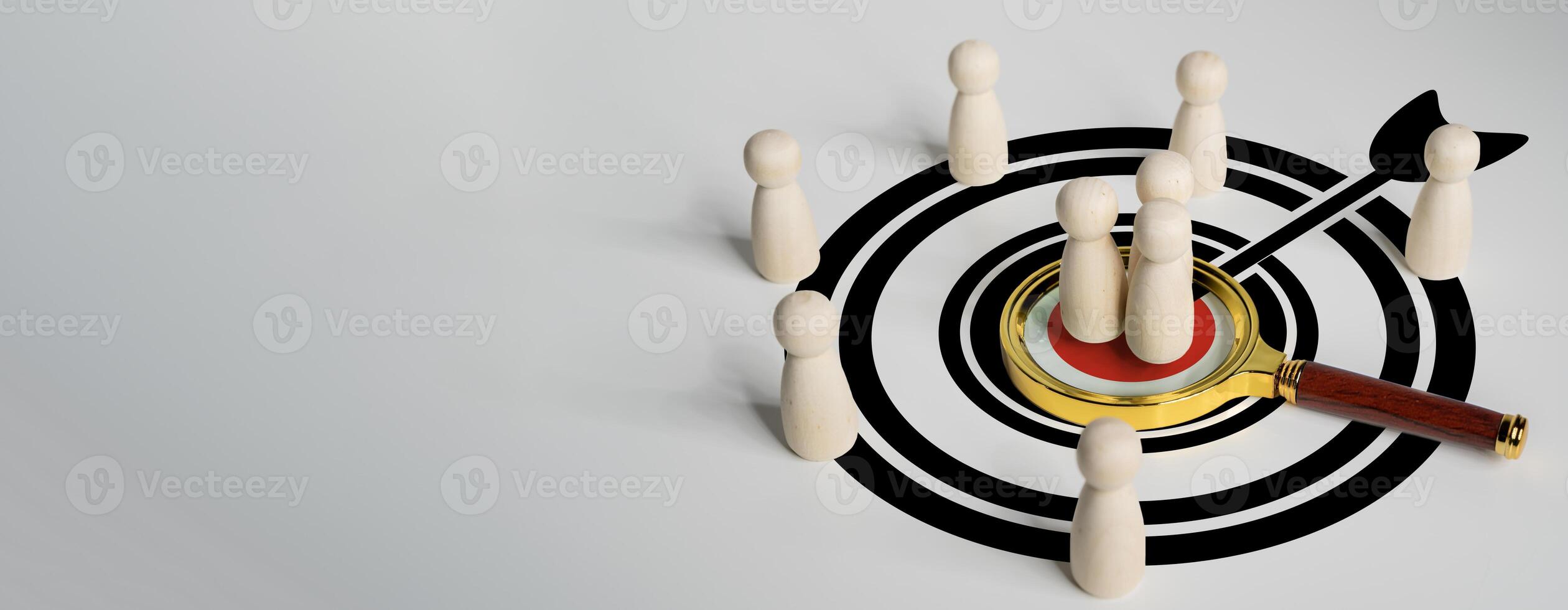 Magnifying glass focus to manager icon which is among staff icons for human development recruitment leadership and customer target group concept. Creating personalized marketing strategies. photo