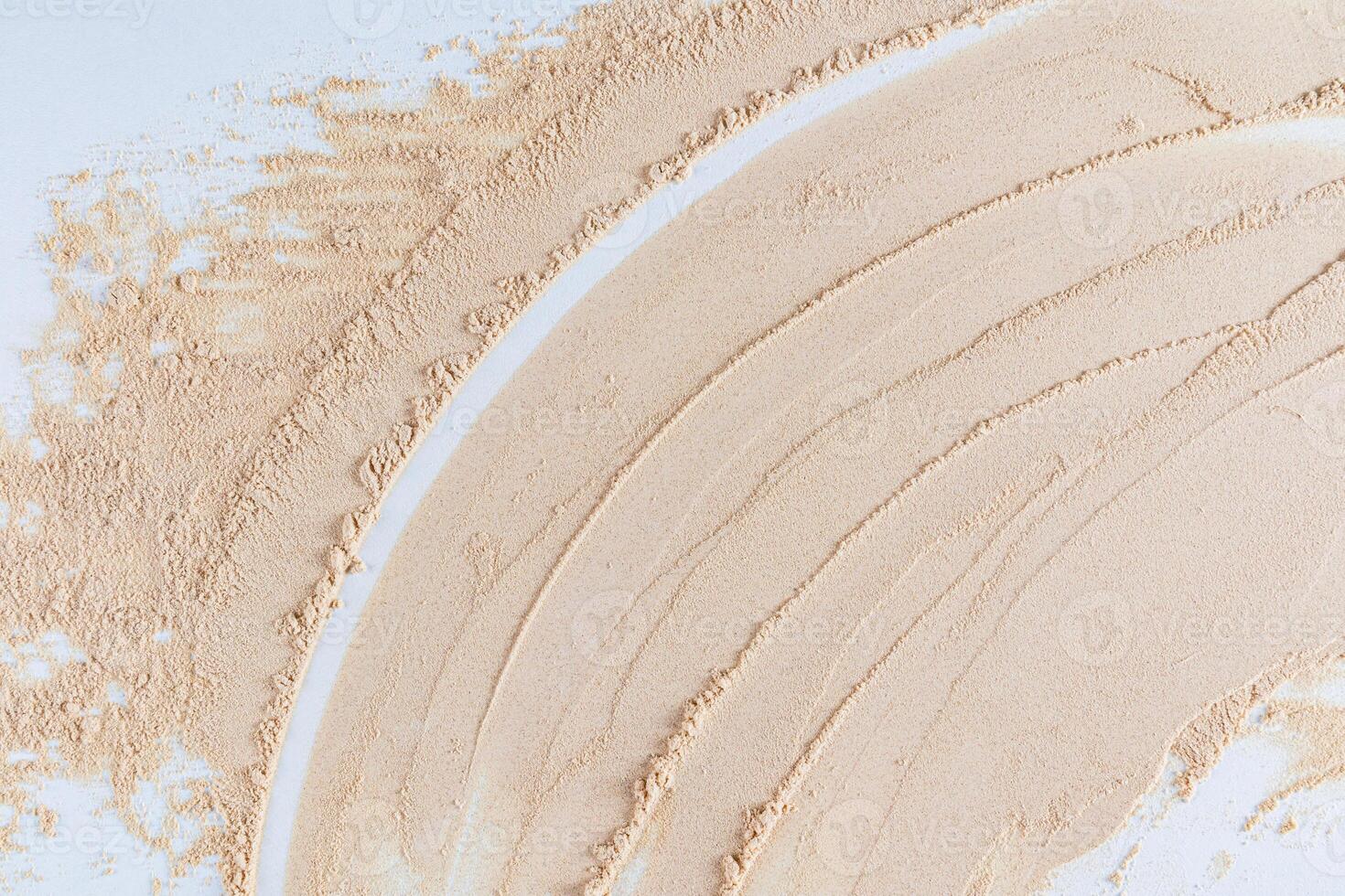 Abstract cosmetic background texture of dry loose powder pastel color. Parallel beautiful lines with a curve. layout for design. A copy space. photo