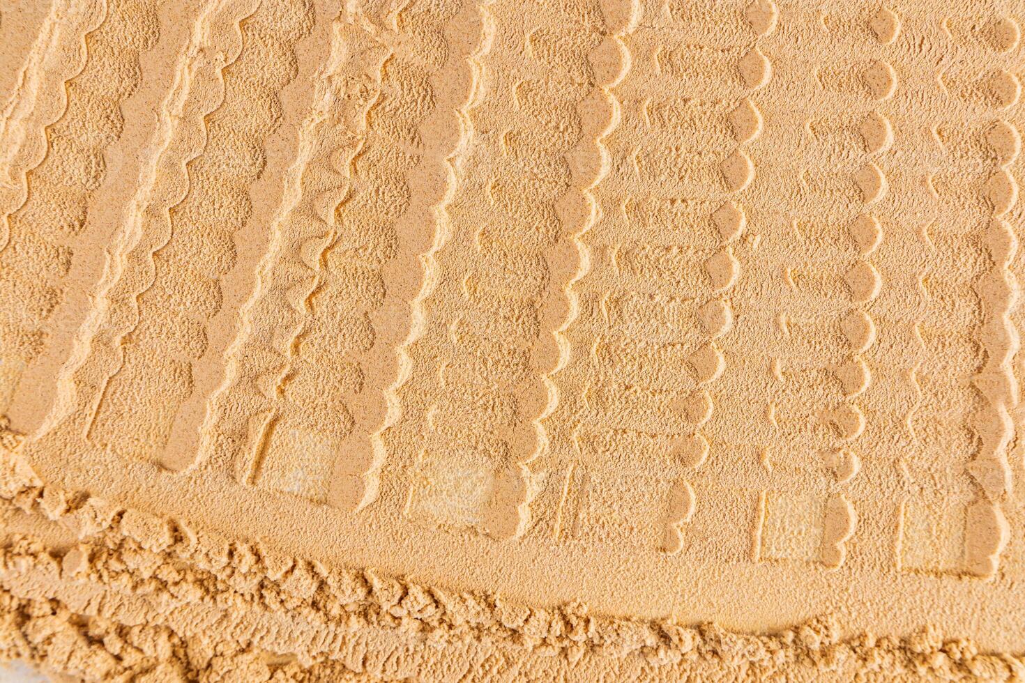 Chic cosmetic background texture of loose dry powder in a delicate light tone. Abstract beautiful lines of powder texture. layout, design photo