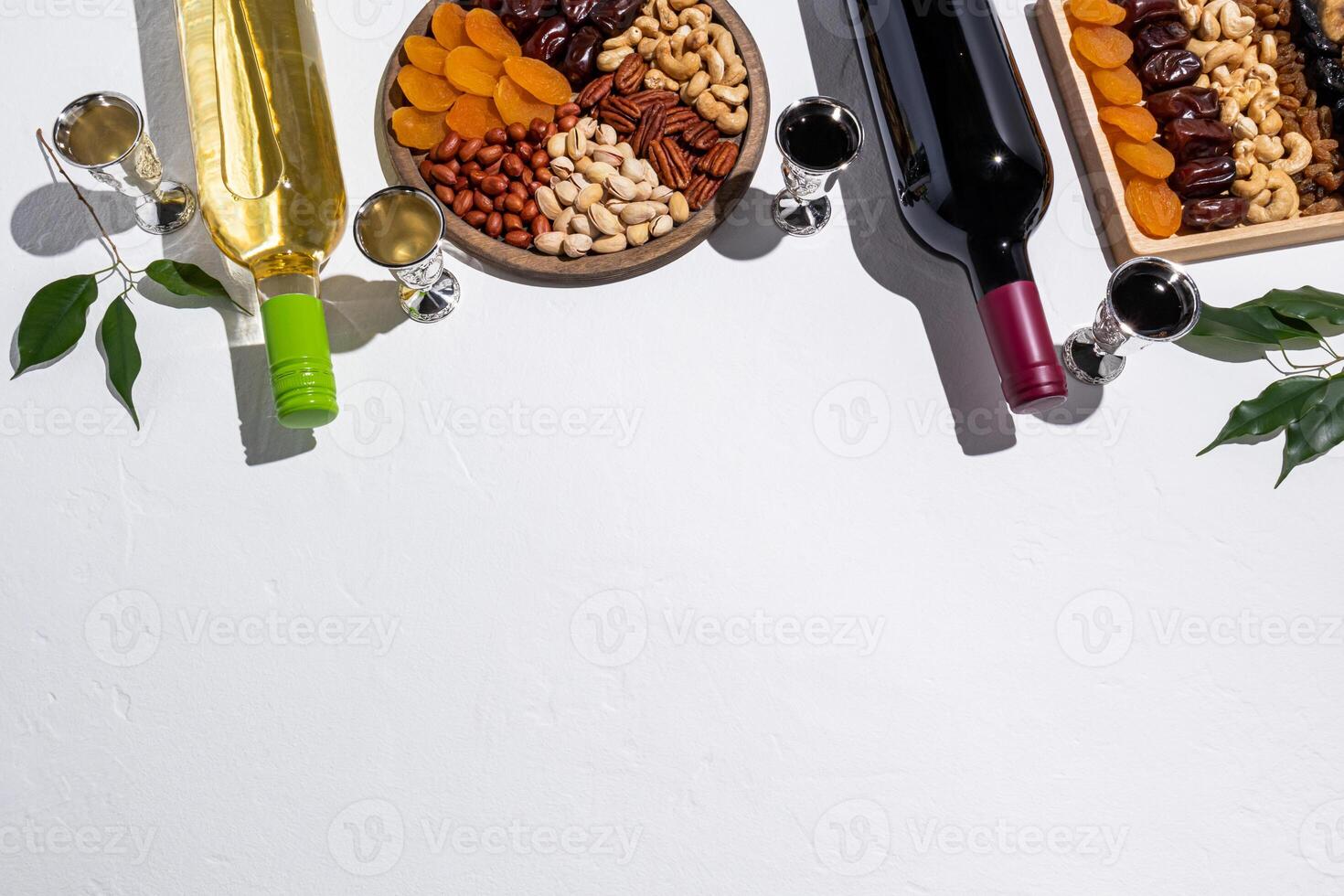 Traditional foods and treats for the Jewish holiday of Tu Be Shvat on a white background. top view. A copy space. top border. photo