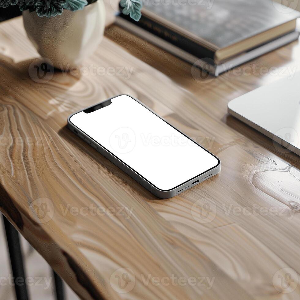 Silver smartphone mockup template with blank screen on wooden table photo