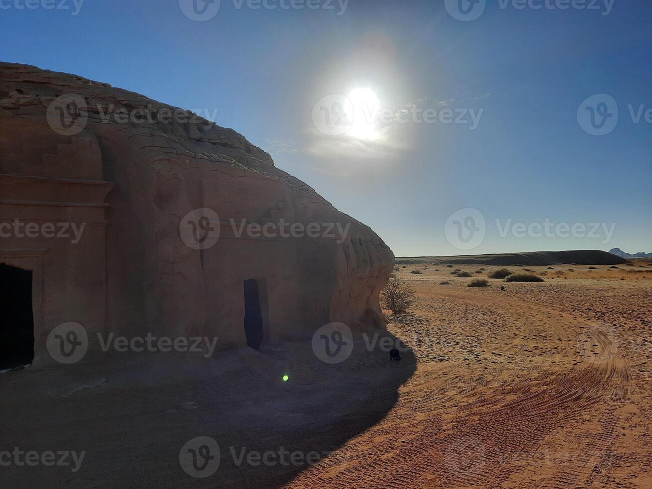 A beautiful view of the caves built into the mountains at the archaeological site of Hegra in Madain Saleh, AlUla in Saudi Arabia. photo