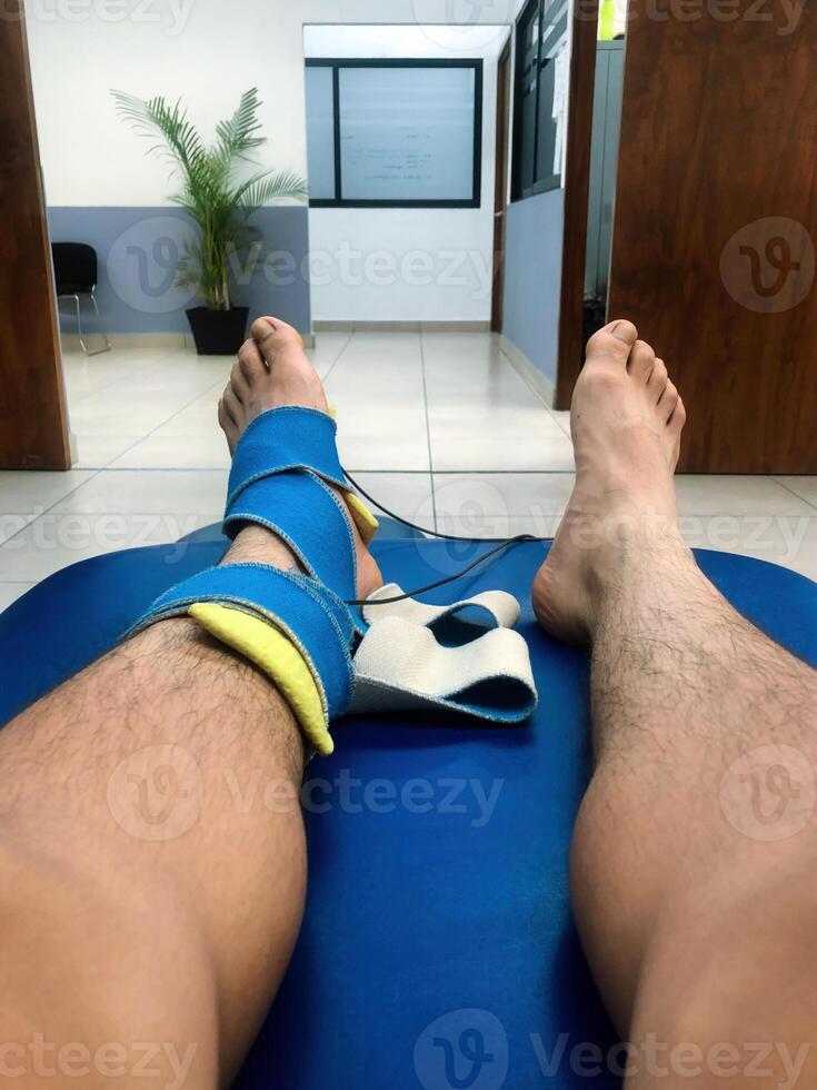 Recovery session in a rehabilitation center focusing on leg therapy and mobility photo