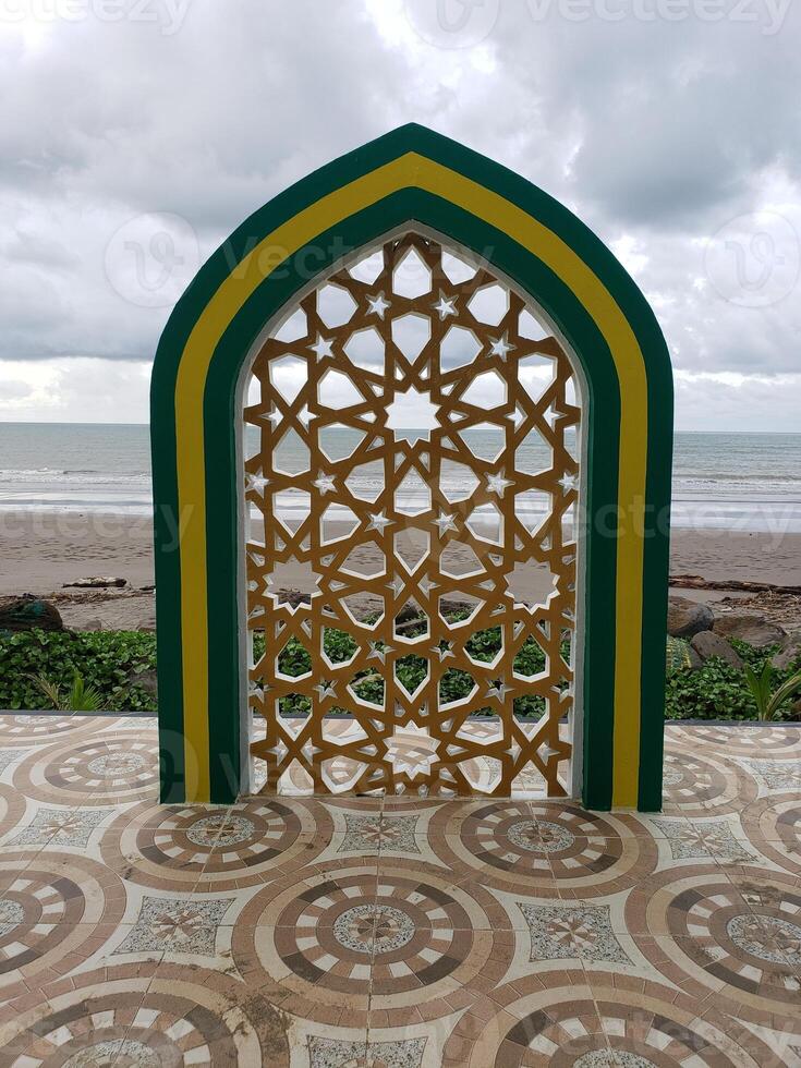 A colorful archway on the beach photo