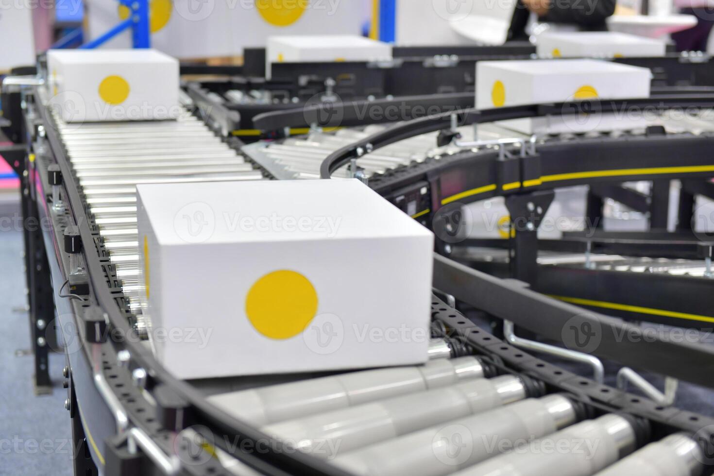 White cardboard boxes on conveyor belt. parcels transportation system concept photo