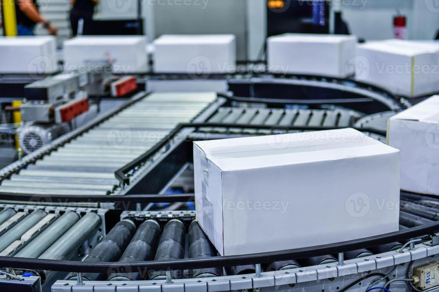 White cardboard boxes on conveyor belt. parcels transportation system concept photo
