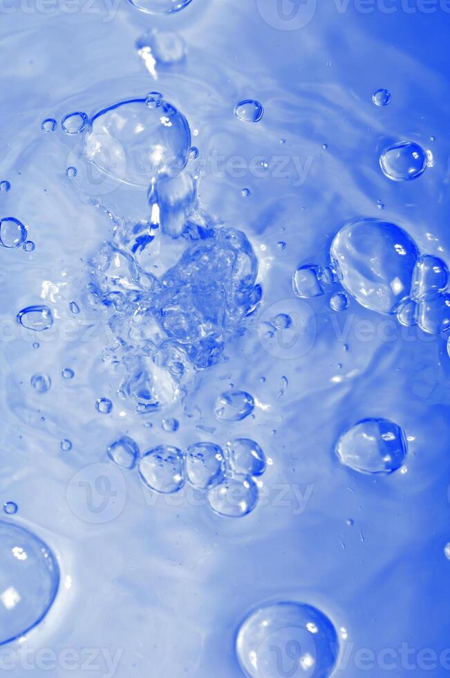 Blue water with air bubles photo