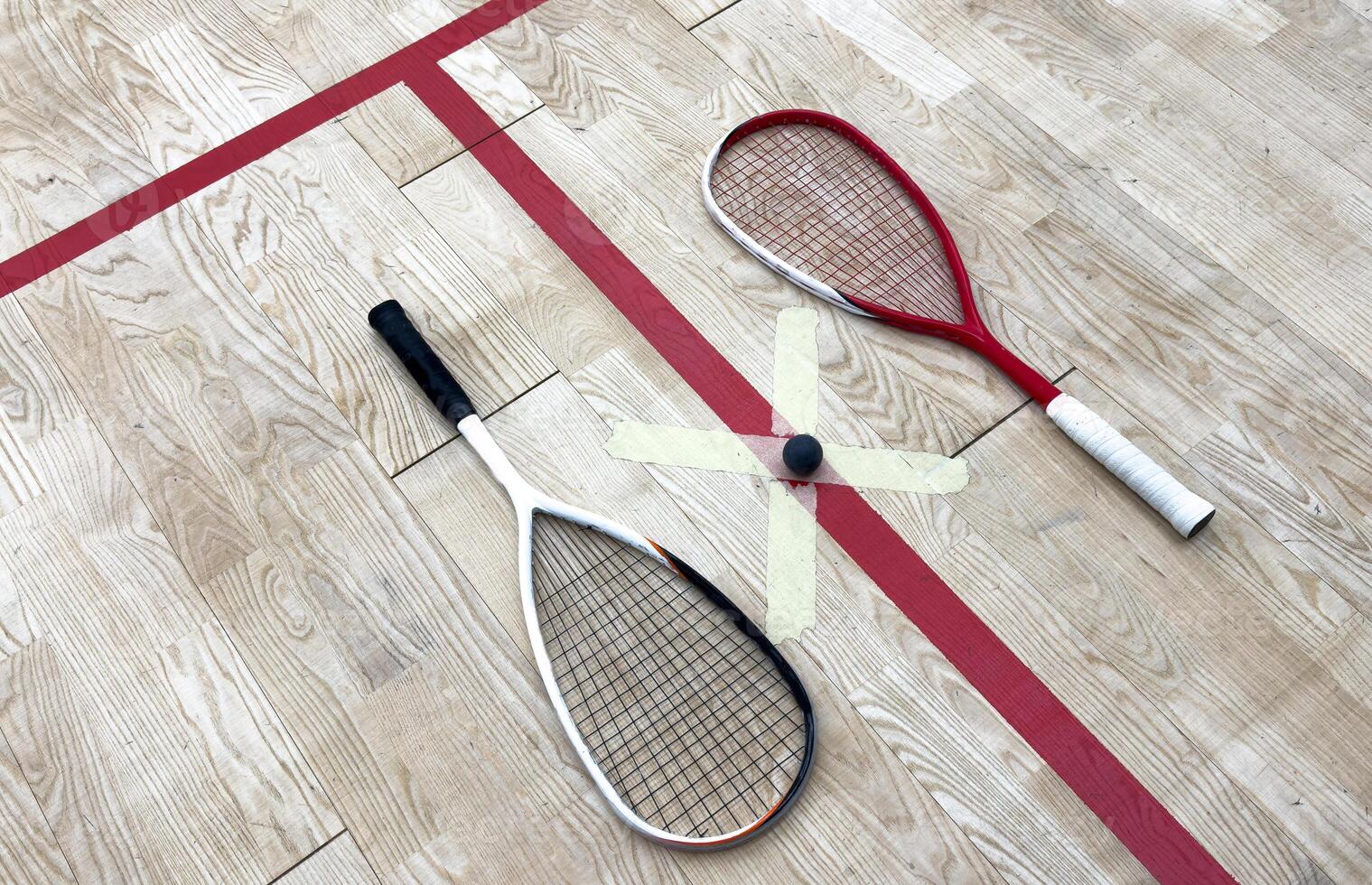 Sports, above and racket on squash court for competition, challenge and training center. Exercise, interior and empty room with top view of wooden floor of gymnasium for games, fitness club and gear photo