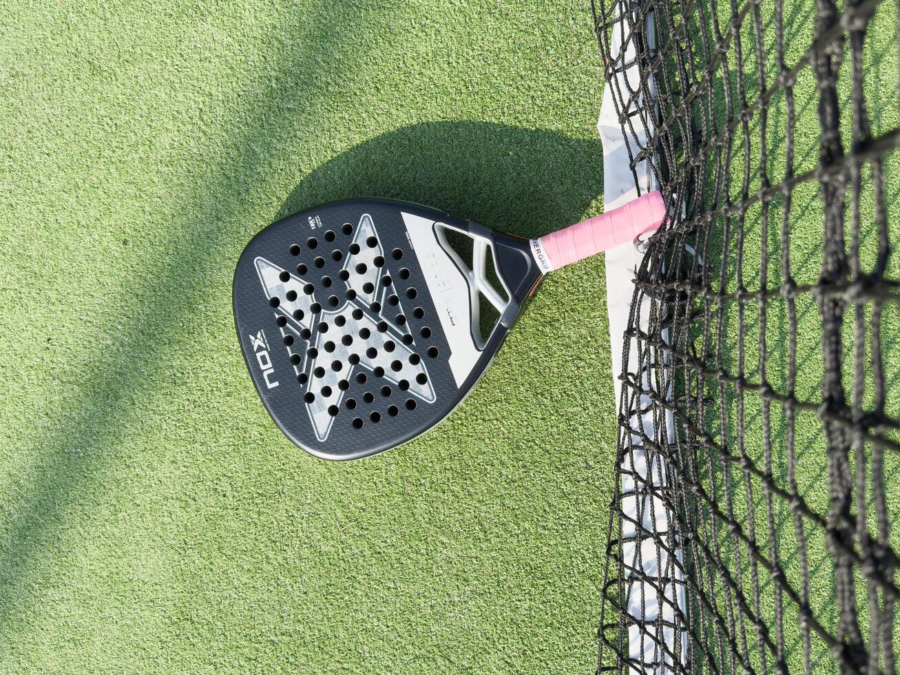 Kyiv, Ukraine, October 23, 2024 padel racket nox on a padel court with a ball photo