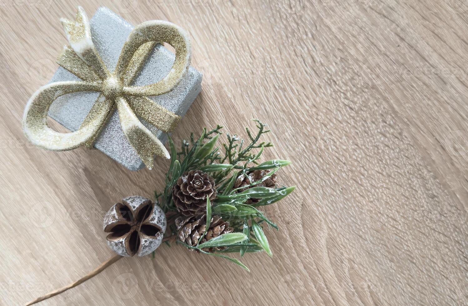A beautiful vertical scene featuring wrapped gifts and elegant ornaments. This festive composition includes ribbons, baubles, and greenery, embodying the joyful essence of the Christmas season photo