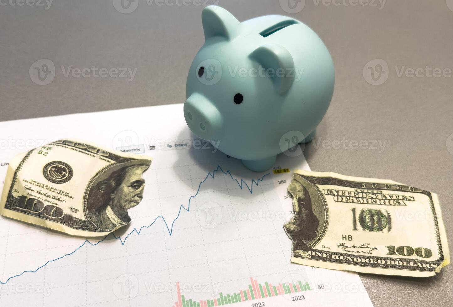 Piggy bank, coins, documents and calculator on the wooden table in the house. Concept of financial, savings, investments, funding. photo