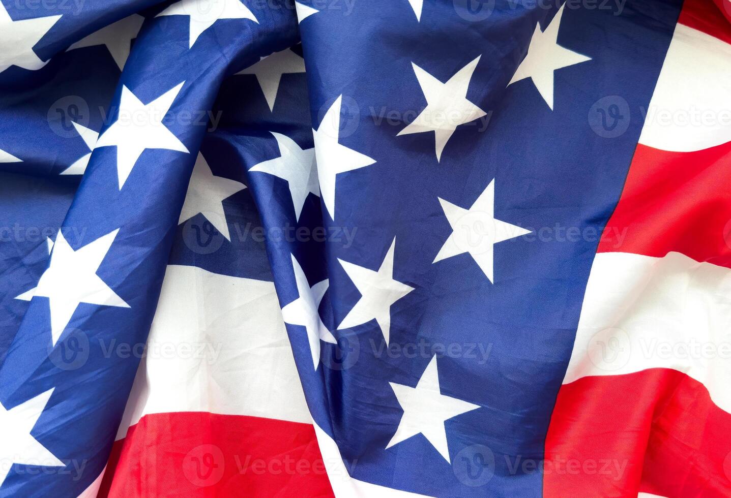 Close up of ruffled American flag. Satin texture curved flag of USA. Memorial Day or 4th of July. Banner, freedom concept photo