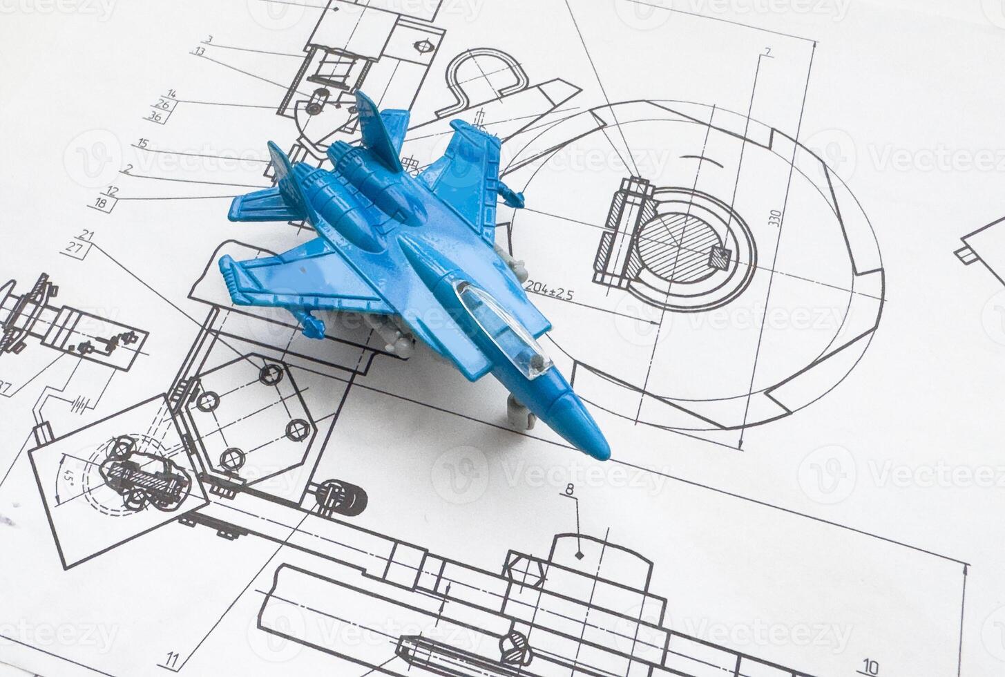 model of the fighter plane on the background of a blueprint photo
