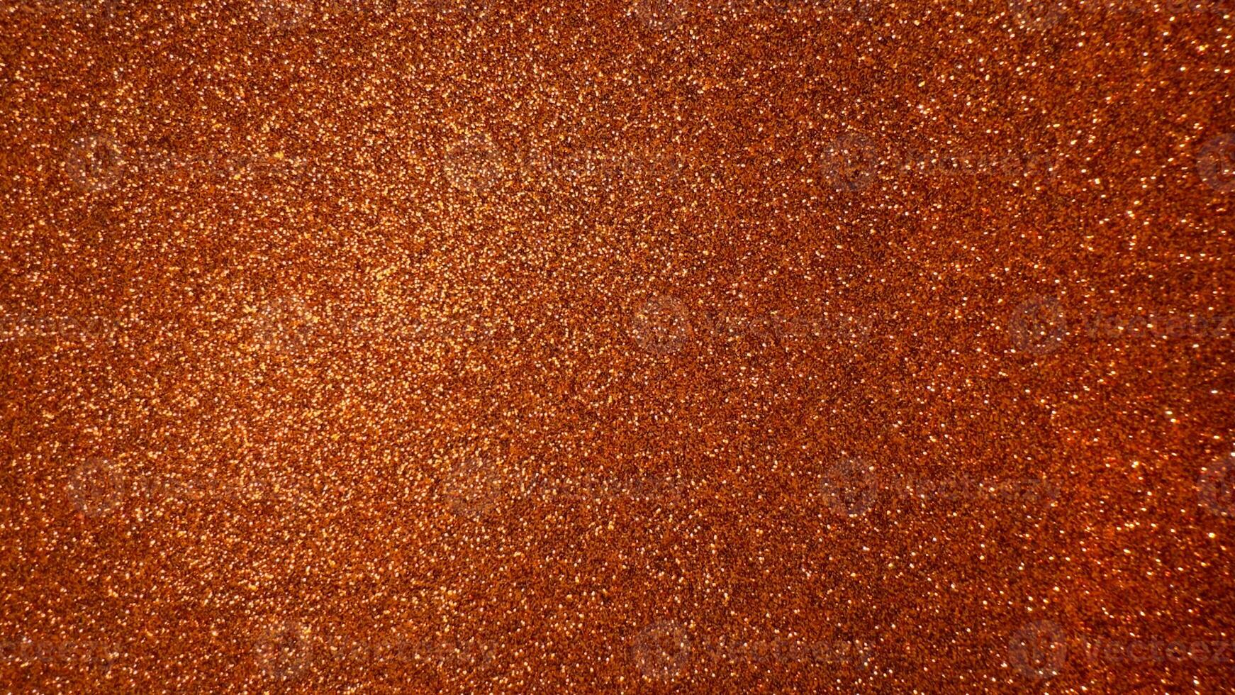 Orange shiny background with foamiran. Decorative foam material with glitter for crafts photo