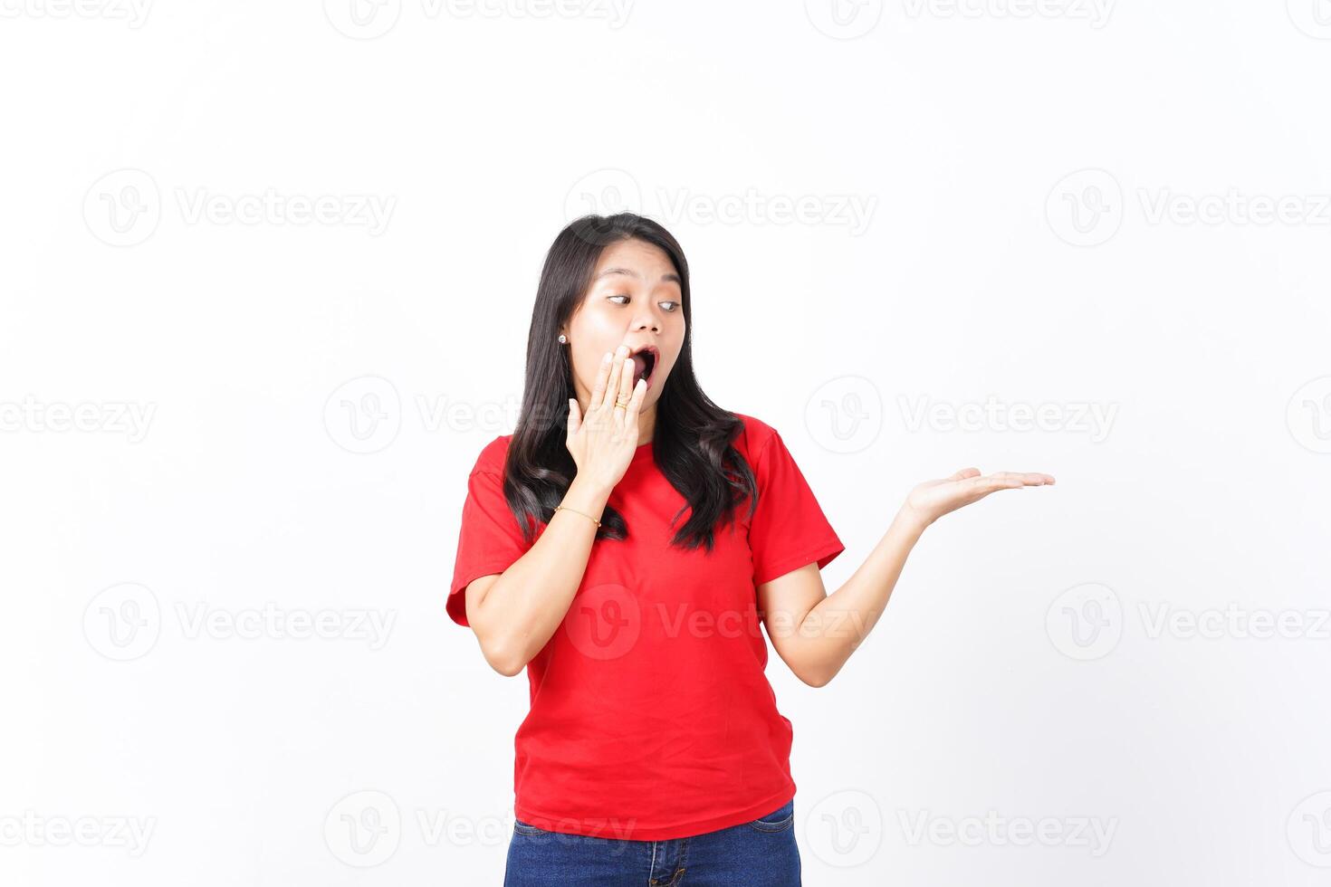 Showing and Presenting on Open Palm with WOW and Shocked Expression Of Beautiful Asian Woman wearing red Isolated On White Background photo