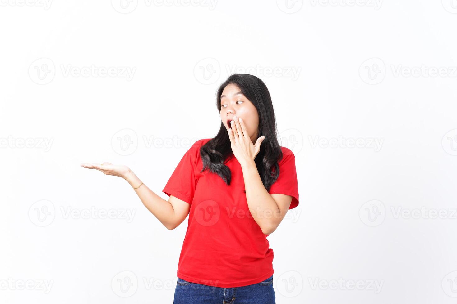 Showing and Presenting on Open Palm with WOW and Shocked Expression Of Beautiful Asian Woman wearing red Isolated On White Background photo