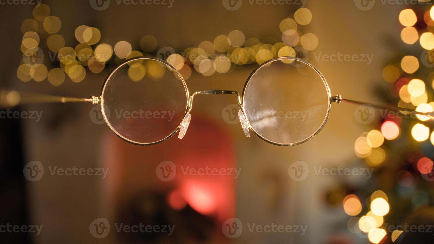 POV Glasses Of Santa Claus Point Of View In Front Of Christmas Tree photo