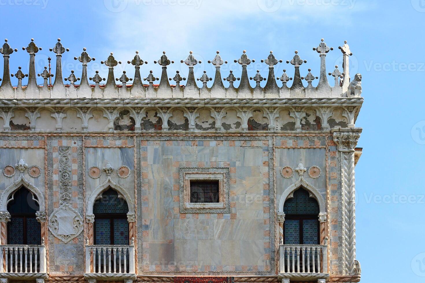 Venetian Architecture Beautifully Framed by a Bright and Clear Blue Sky photo
