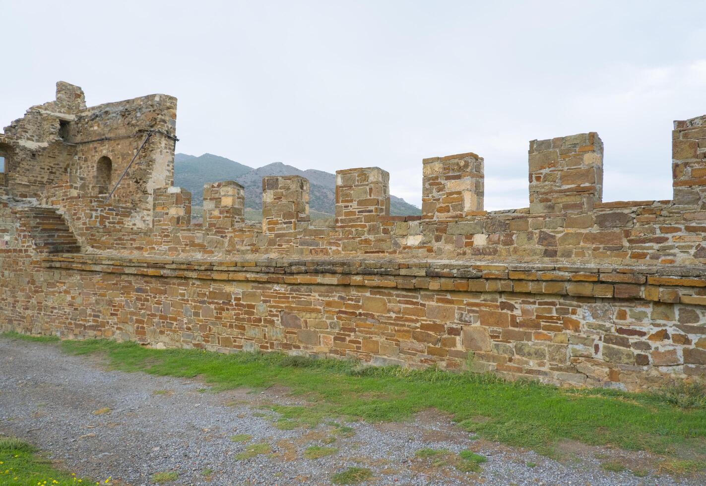 Old Genoese fortress in the city of Sudak in summer. Ancient architecture of Crimea. photo