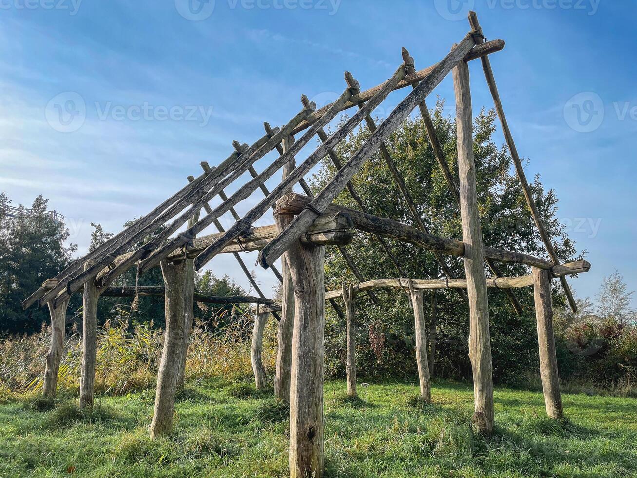 The Wooden house. Artwork of a frame of a house, made of branches. photo