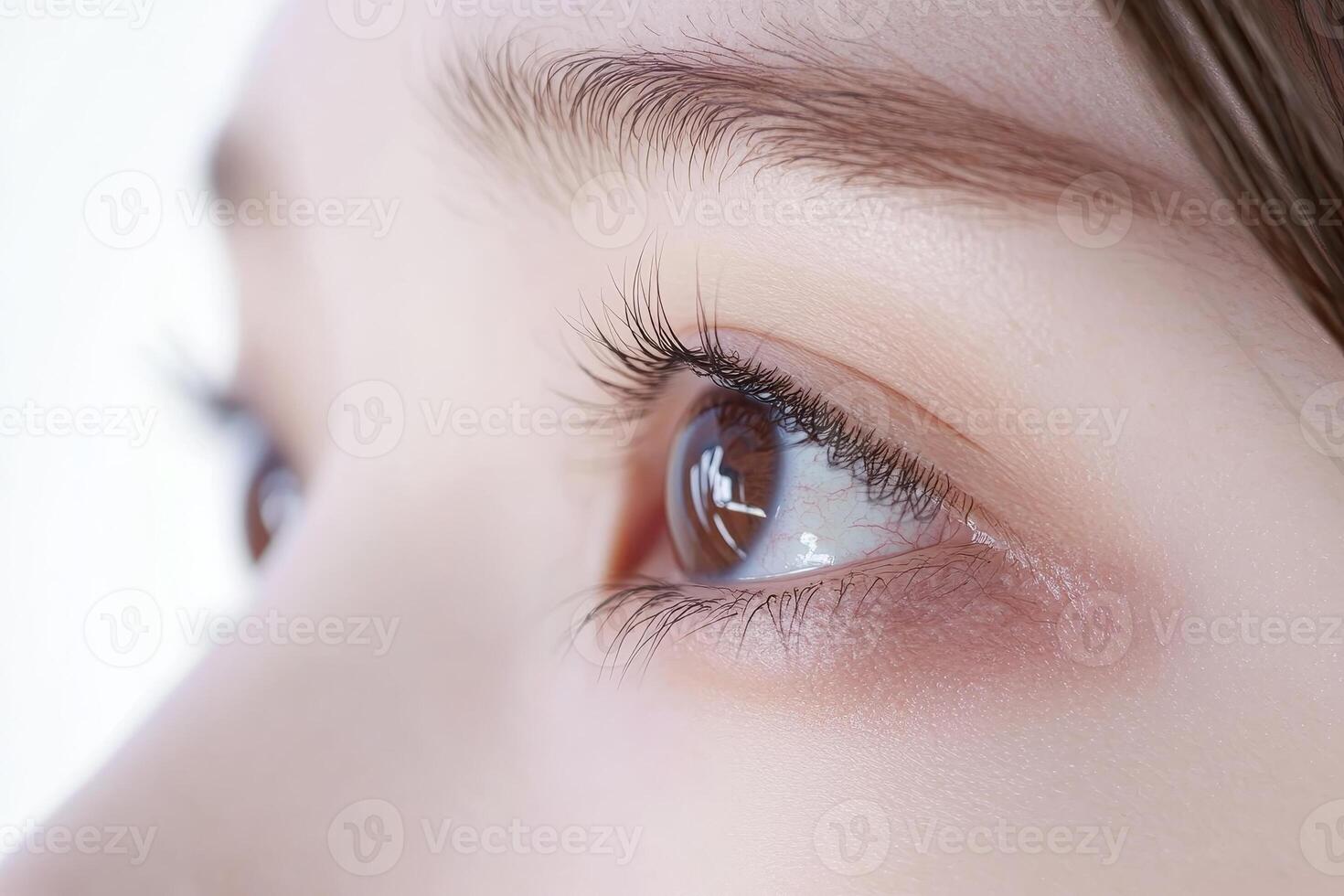 Stunning closeup of a Japanese woman, striking brown eyes, delicate skin, and a unique mole against a minimalist backdrop photo