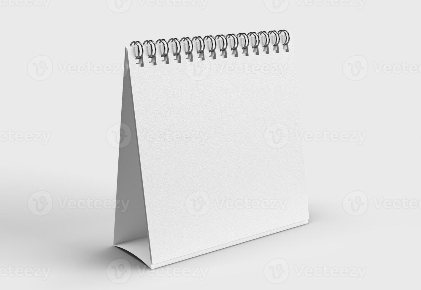 white paper desk calendar on white background for mockup photo