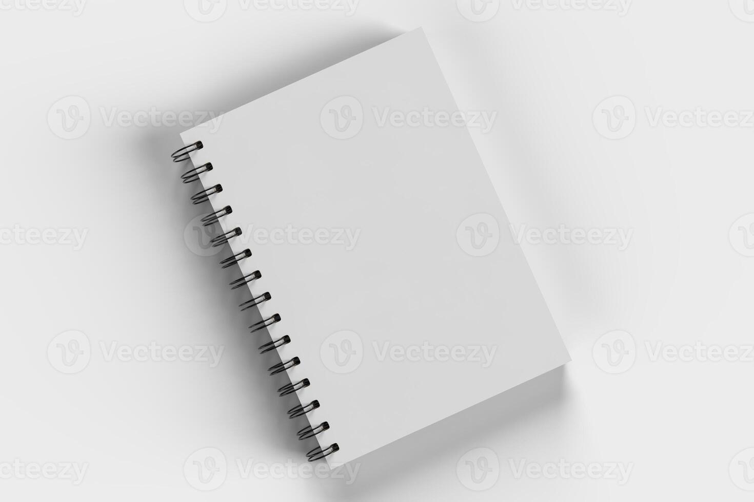 White diary with wire-o on white background photo
