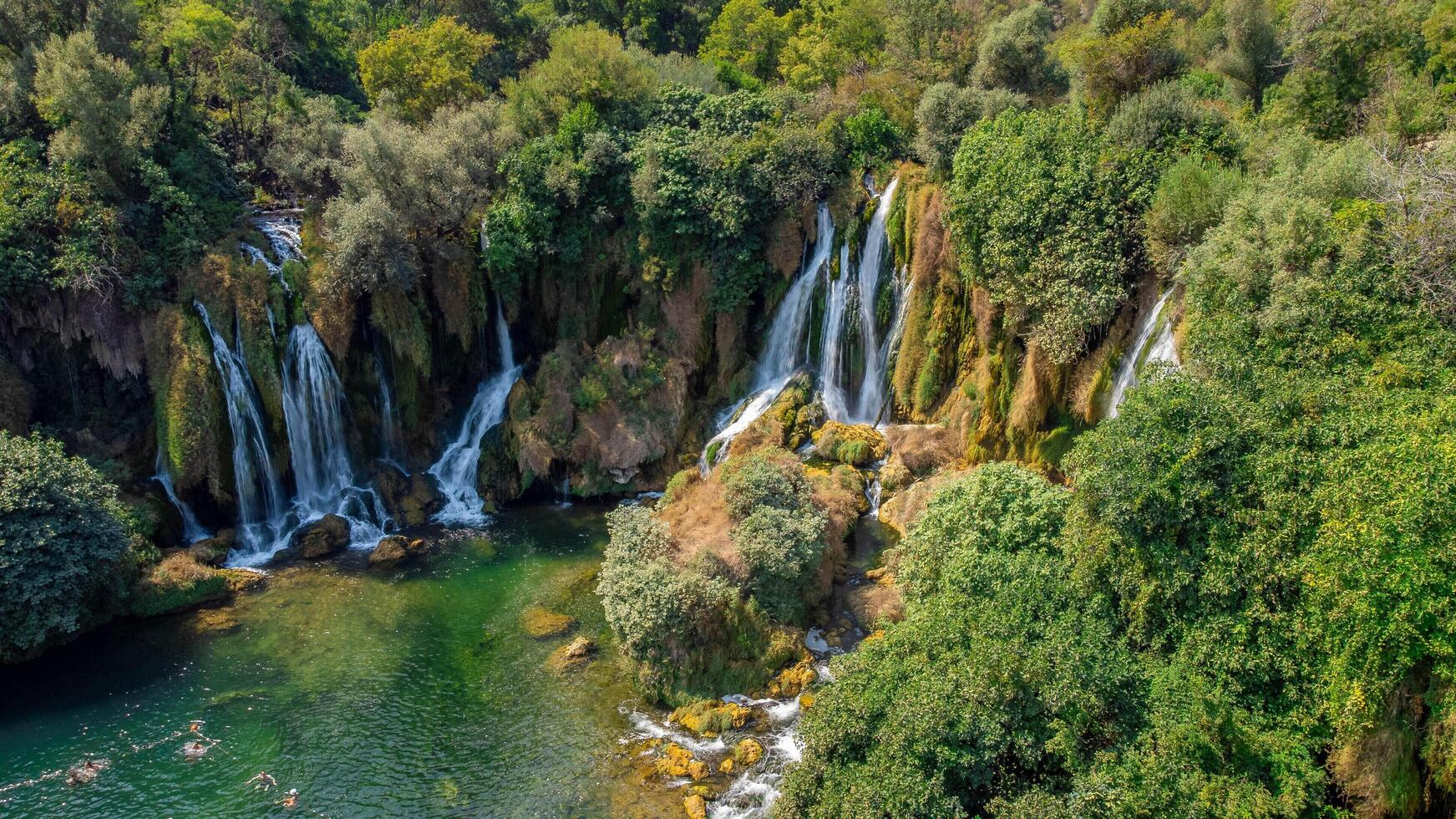 Waterfalls in nature. Water source of life, flowing water in a forest. Kravice waterfalls, Bosnia and Herzegovina. photo