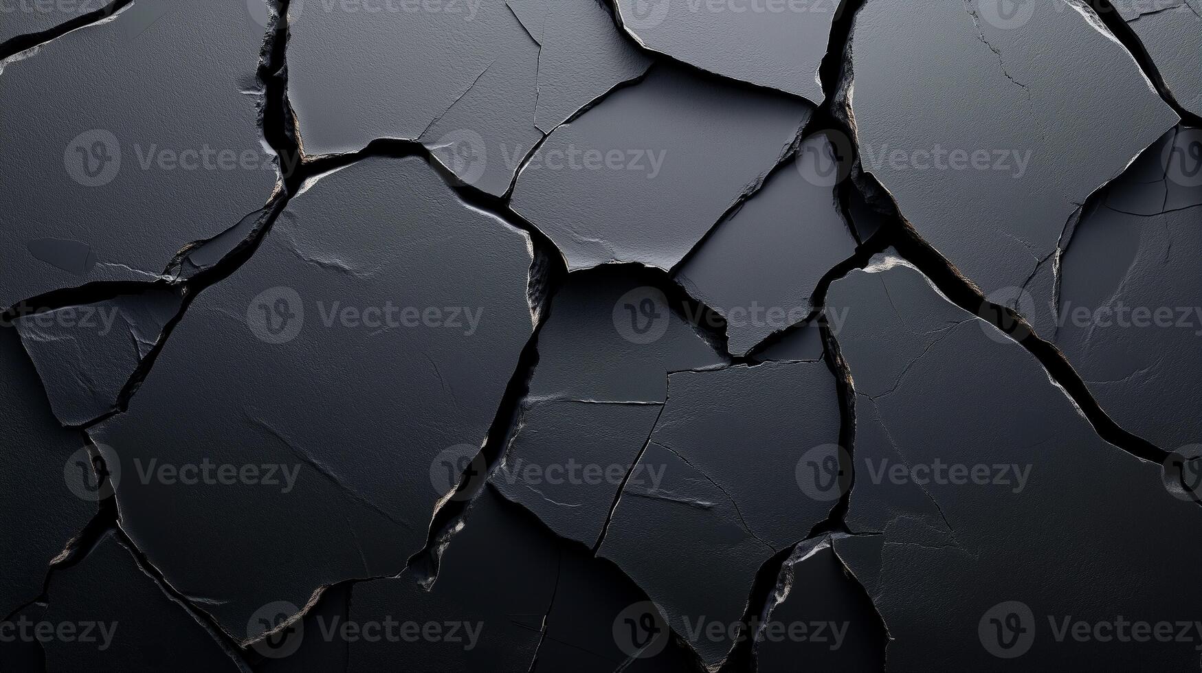 Black cracked surface resembling dried clay or rock photo