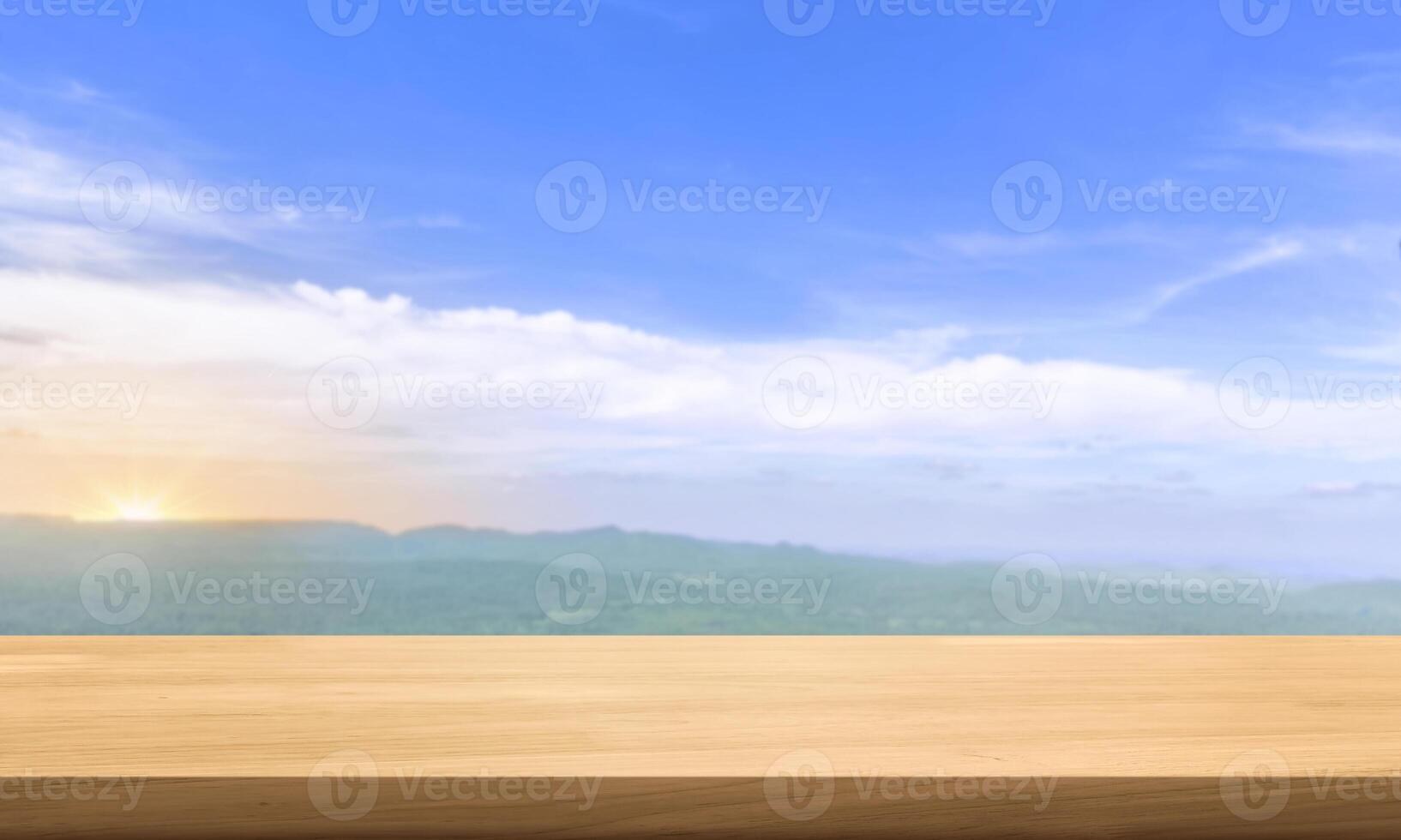 Empty wooden table with blurred background of nature and green forest for placing advertising products. photo