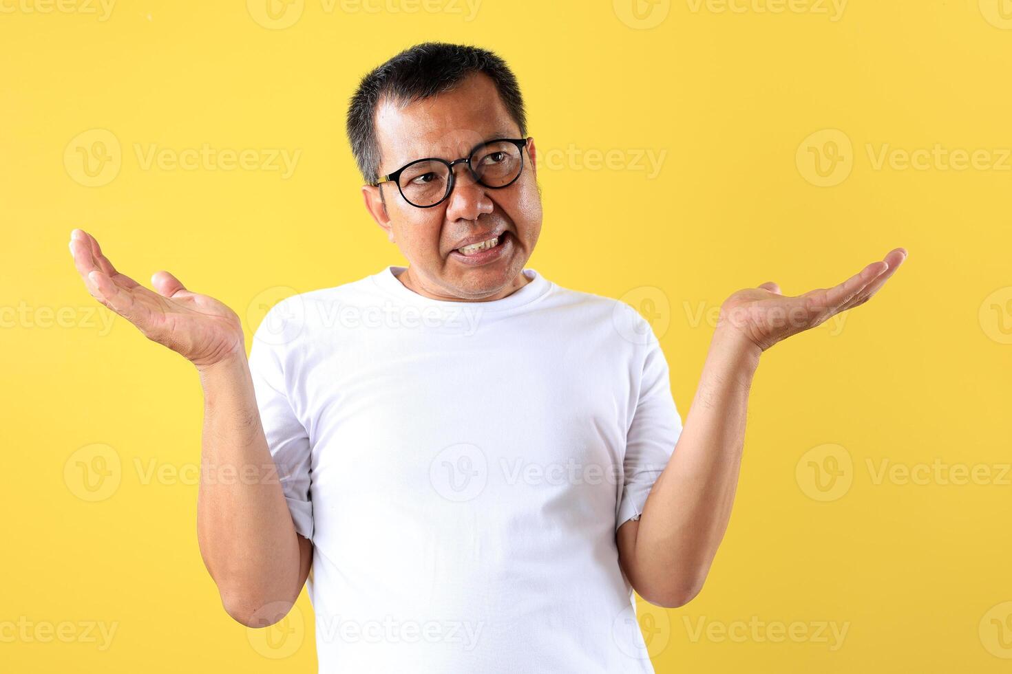 Middle Age Asian man using White T Shirt with Shrug Expression photo