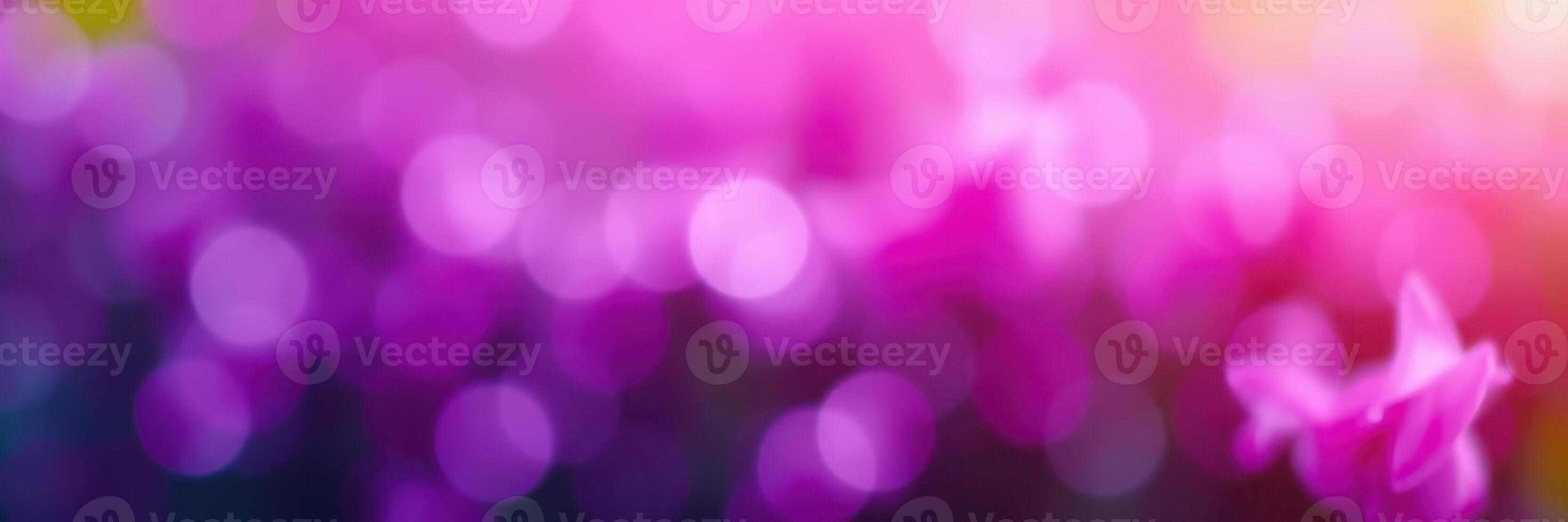 Colorful bokeh effect with shades of purple and pink creating a dreamy atmosphere for celebrations or artistic backgrounds photo