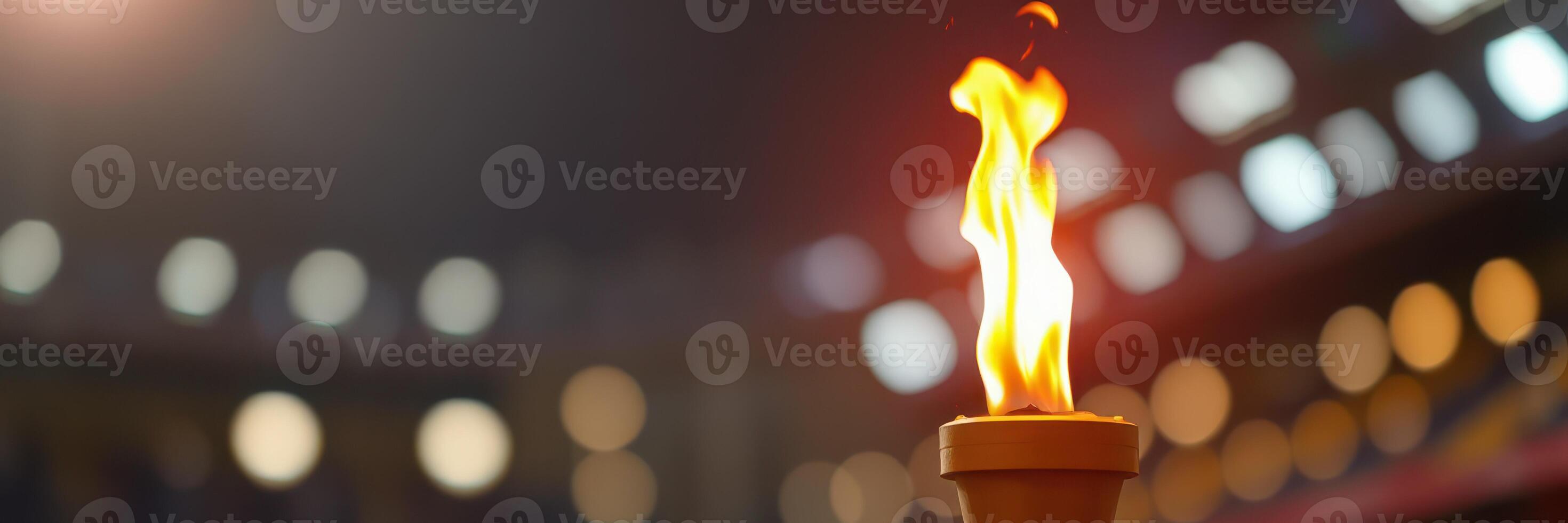 Torch burns brightly in a stadium during an evening ceremony celebrating unity and hope photo