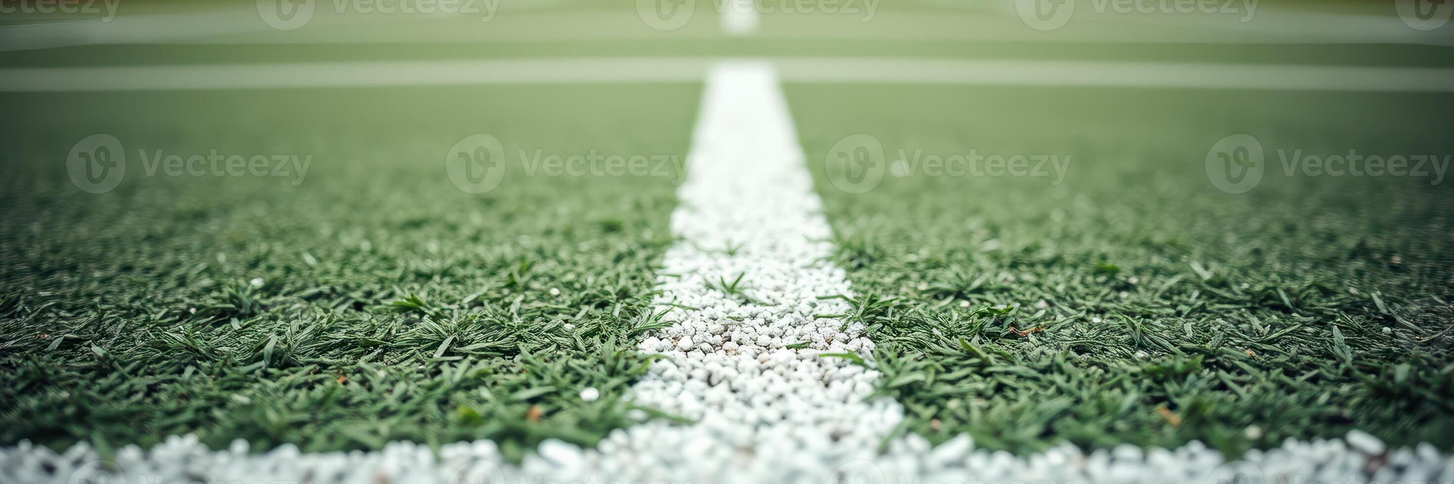 Green artificial turf field with white lines marking the play area for sports activities during daytime photo