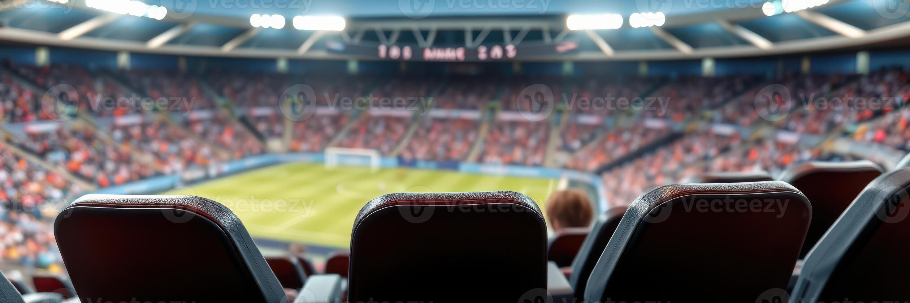 Spectators await the excitement of a live football match in a bustling stadium filled with fans in a vibrant atmosphere photo