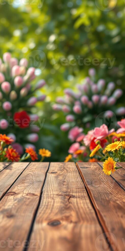 Beautiful garden with vibrant flowers and a wooden surface in a sunny atmosphere photo