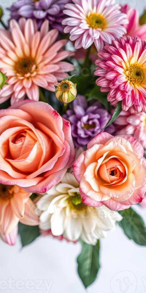 Bright bouquet of mixed flowers including roses, daisies, and chrysanthemums arranged beautifully in a vibrant display photo