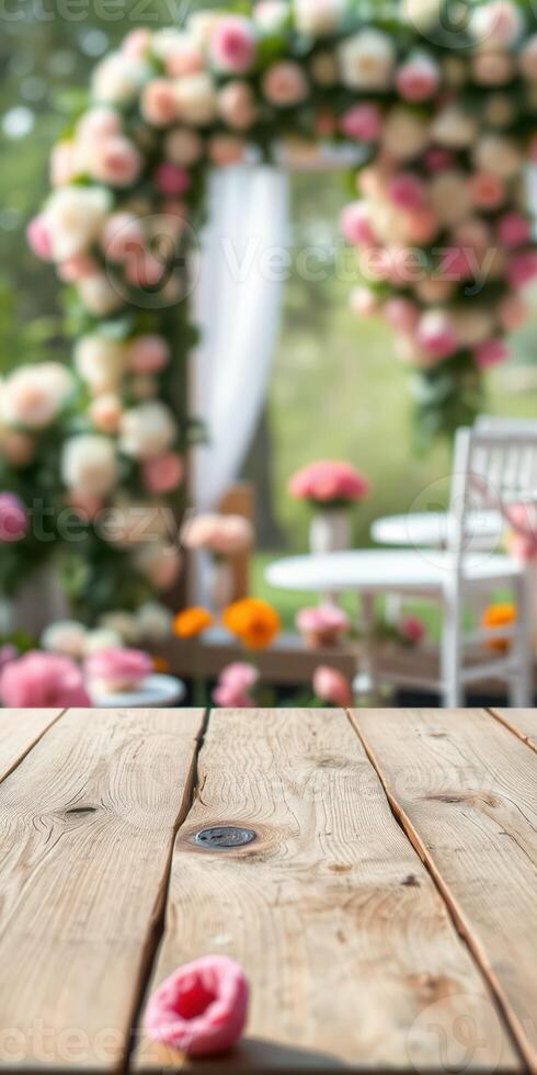 Elegant floral decorations enhance the ambiance of a garden event in springtime with wooden tables and vibrant centerpieces photo