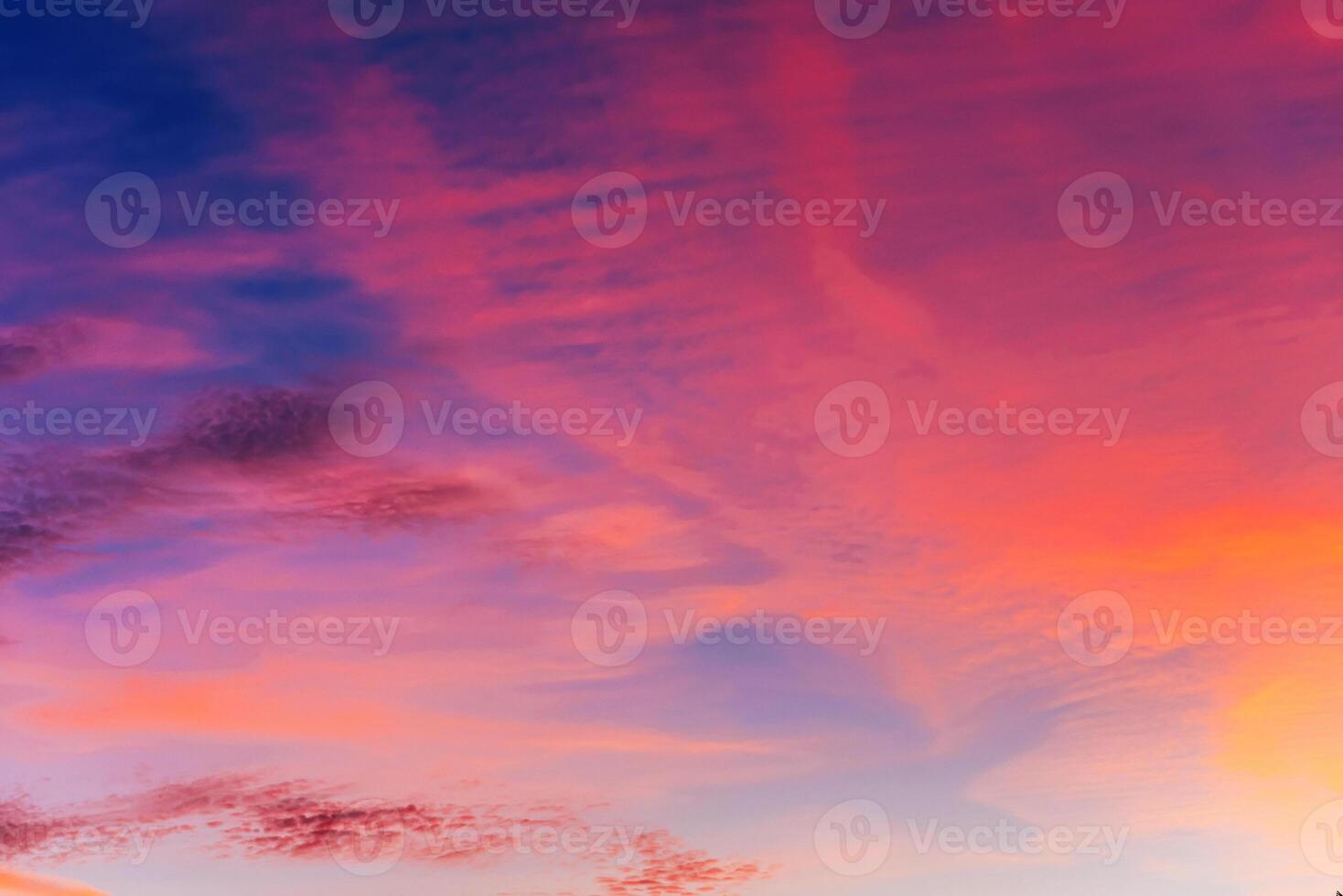 Pink clouds at sunset in a beautiful sky in evening photo