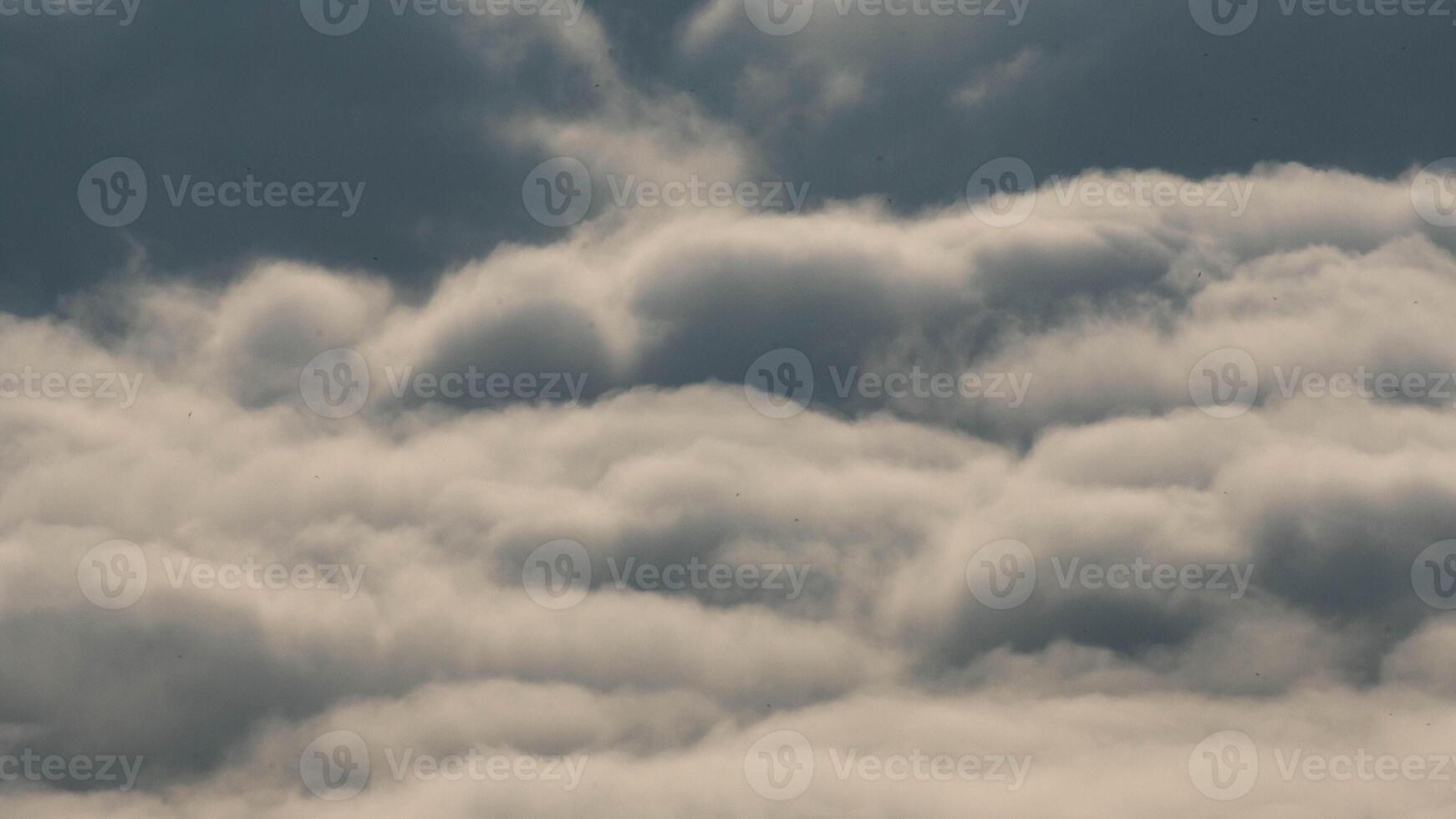 Time lapse of flowing fog waves over mountains. Amazing nature background of beautiful ocean of clouds in the morning. photo