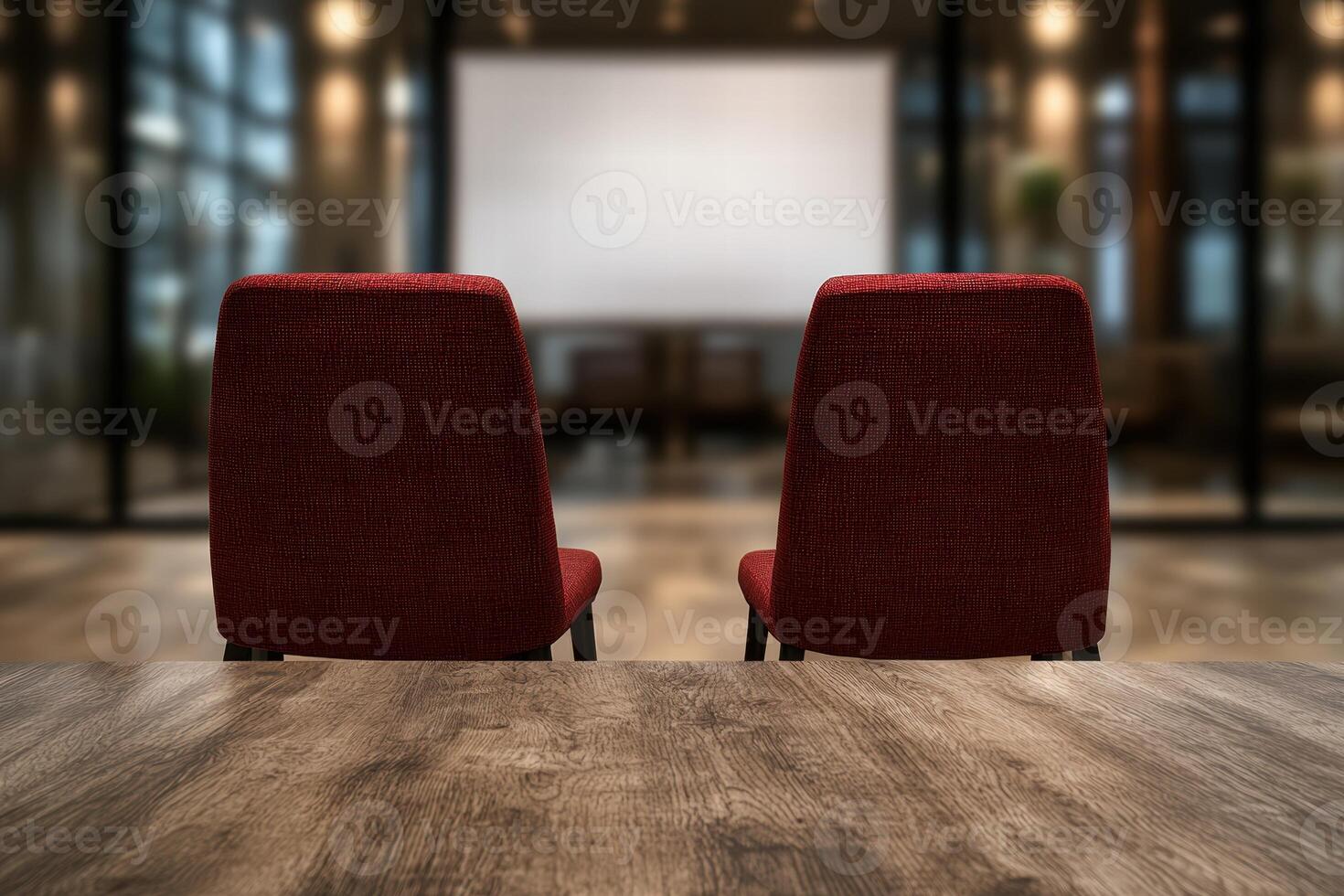 empty auditorium with red chairs and projection screen photo