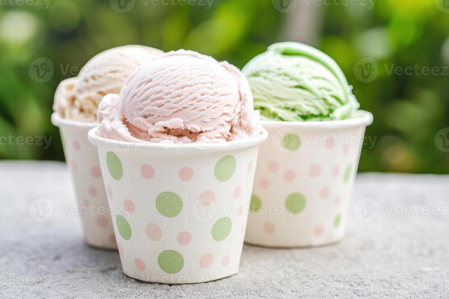 Colorful ice cream scoops in polka dot cups photo