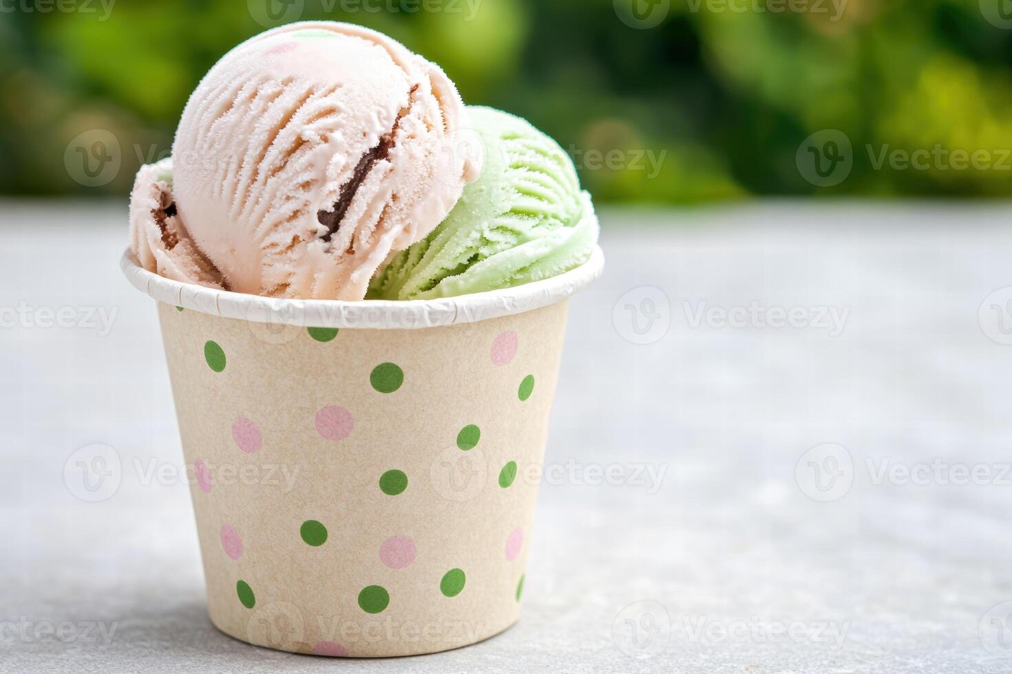colorful ice cream scoops in a polka dot cup photo