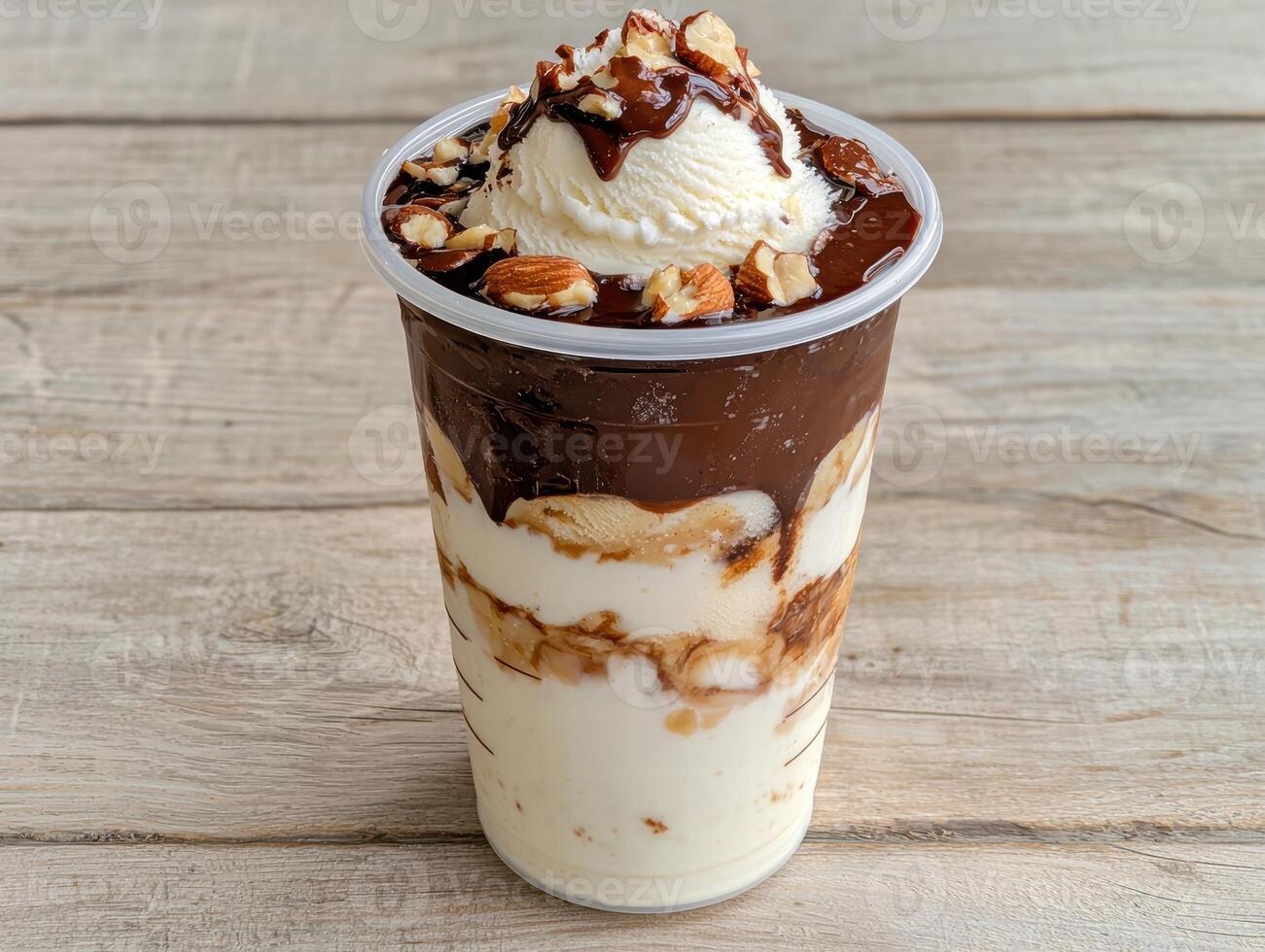 delicious layered chocolate and vanilla dessert in a cup photo