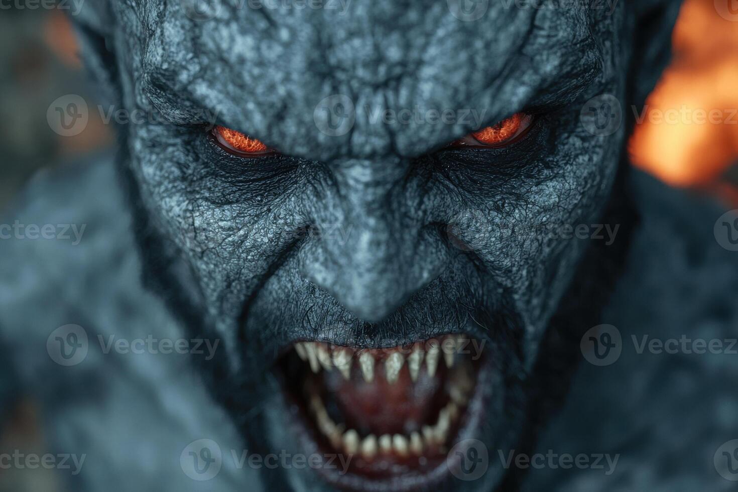 Terrifying monster with glowing red eyes and sharp teeth photo