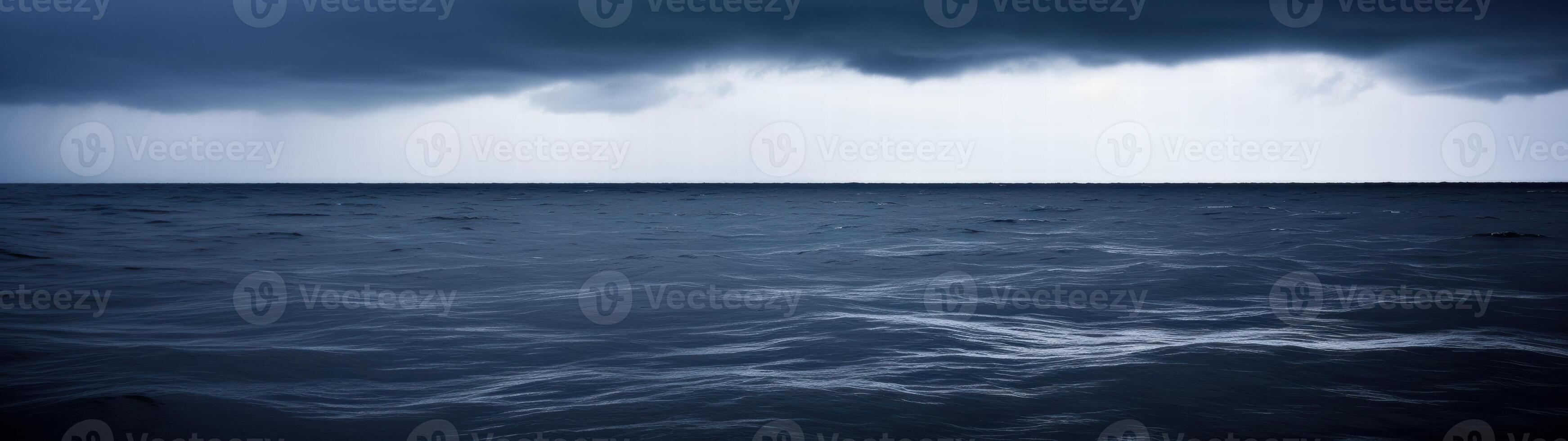 Dramatic stormy seascape with dark clouds and choppy waves photo