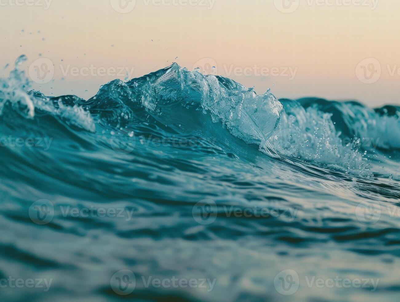 Crashing ocean wave at sunset photo